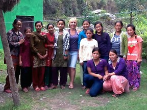 Laura Levtov is shown with women and girls she met in Nepal. The Madoc woman's Freedom on Ice charity sent 10 girls from Nepal to school last year. Levtov is raising funds for the program with an event this weekend.