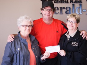 Alma Pankratz (left) and Linda Chapple (right) from United Commercial Travelers hand a $2,000 cheque to Shane Moffat of the BDO Centre. The money will be used as part of the centre's $190,000 upgrades to the ice plant and air unit. (Svjetlana Mlinarevic/The Graphic/QMI Agency)