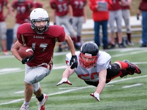 Midget Lion Grayson Jaborsky evades a Stamps defender in a May 2 game.