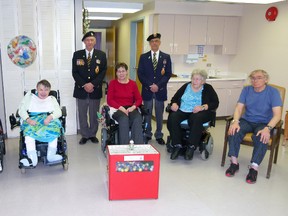 Long-term care residents (l-r) Ivy Lambrecht, Mary Waknuk, Rita Schofield, Ruth James and Harlan Hunt came around to thank legion representatives Ian MacDonald and Lionel Marier for the legion’s donation.