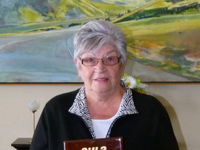 Betty James with her Award of Distinction from the AHLA