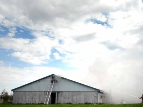 Firefighters from three detachments battled a pig-barn blaze near Newton Thursday. (SCOTT WISHART, The Beacon Herald)