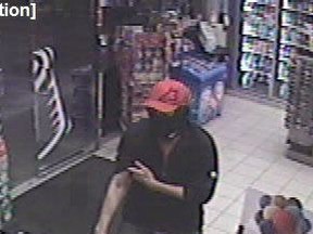 Surveillance photo of a suspected Petro-Canada robber, taken on Monday, April 29.