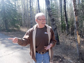 Kirsten Goruk/Daily Herald-Tribune
Ken Belke, vice-president of the Camp Tamarack Association tours the area where the camp’s new adventure facility will be built. Construction is slated to start on May 28 and will be done in time for campers this summer. The facility includes a 200-foot twin zip line.