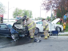 Cornwall firefighters respond to a two-car collision at the intersection of Montreal Road and Bryden Avenue that slightly injured a Canadian Armed Forces soldier on Thursday. No other details were available at press time.
Staff photo/GREG PEERENBOOM