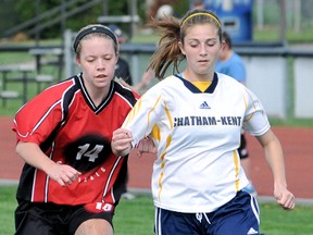 Chatham-Kent Golden Hawks' Jessie Chinnick, right, protects the ball from Lambton-Kent Cardinals' Kaley Veldboom during a Kent girls soccer game Thursday at the Chatham-Kent Community Athletic Complex. Game star Ellen Wanamaker and Alicia Huckle each scored three goals and Hunter Medd added one as the Golden Hawks won 7-0. Britt McLaren had the shutout for the Golden Hawks (4-0-0), who are tied for first place with the Ursuline Lancers. (MARK MALONE/The Daily News)