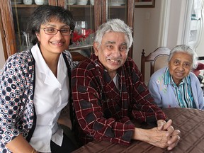 Aelian Weerasooriya, centre, who has an incurable lung disease and is receiving support from Hospice Kingston as he spends his last days at home, sits with his daughter Kay and wife Winifred.
Michael Lea The Whig-Standard
