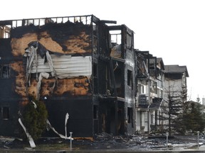 Firefighters were still on scene Friday morning after fighting the blaze at the Sonora Apartments in Stony Plain on Thursday. They managed to pull three cats out of the wreckage in the morning and return them to their owners. - Thomas Miller, Reporter/Examiner