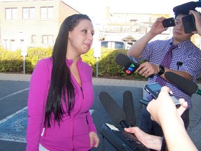 Julie Bilotta leaves the Cornwall courthouse in this QMI file photo.