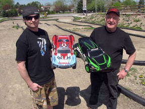 Todd Kendel, left, and his father Curt Kendel opened an offroad track for remote control cars at their WCK Honda dealership this month. Curt says that, as far as he knows, it's the first public track of its kind in the region. (CATHY DOBSON, The Observer)