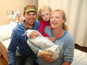 Maxwell Foster, who was born Thursday, is joined by his family, parents  Jill and Chris Hendsbee, and sister Hazel. (John Lappa, The Sudbury Star)