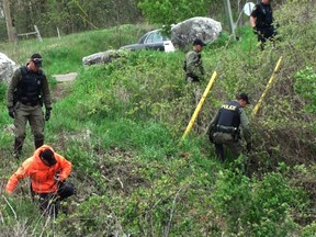 Ontario Provincial Police search in the west end of Brantford for any clues into the disappearance of Timothy Bosma of Ancaster. (VINCENT BALL Brantford Expositor)