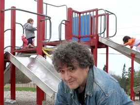 Bruce Wilson checks the hard ground with his pick ax underneath the pea gravel at O'Connor Park.
Ian MacAlpine The Whig-Standard