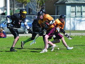 Action from the PCI Trojans/Sagkeeng Wolves lacrosse game on May 10. The Trojans won 9-0. (Kevin Hirschfield/THE GRAPHIC)