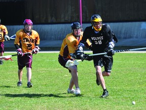 Action from the PCI Trojans/Sagkeeng Wolves lacrosse game on May 10. The Trojans won 9-0. (Kevin Hirschfield/THE GRAPHIC)