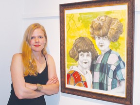 STEPHEN UHLER    The Valley Arts Council held its annual juried art show on Thursday, where more than 80 entries were judged. Here, Emily McPhee stands with her work Vintage Girls, which placed first in the Mixed Media category.