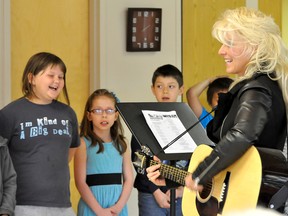 Students from Val Smith's Grade 3 class at North Memorial School brought some vocal sunshine to the residents of Douglas Campbell Lodge Friday afternoon as a pre-Mother's Day treat. Their repertoire included "On Top of Old Smoky", "You are my Sunshine" and their theme song for the school year, "Rockin’ and Rollin’ in Grade 3". (CLARISE KLASSEN/PORTAGE DAILY GRAPHIC/QMI AGENCY)