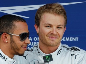 Lewis Hamilton (left) will start alongside Mercedes teammate and polesitter Nico Rosberg for the Spanish Grand Prix Sunday. (AFP)