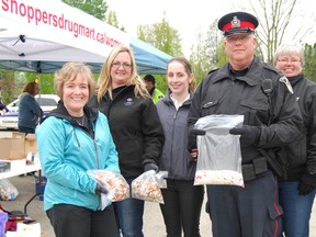 Narcotics, other prescribed drugs and over the counter medication found its way to the first annual Drug Drop off Day in Woodstock. The event was organized by the Woodstock police, Shoopers Drugmart, and the drug task force. Left to right, Lisa Siverthorn from Shoppers, Theresa White, drug task force, Amanda Cook, Oxford County Public Health,Const. Steve McEwen, Jan Houk, CrimeStoppers and Const. Eric Hiiuvain.  (TARA BOWIE, Sentinel-Review)