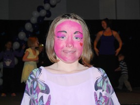 Ema Hodgkinson, 8, had her face painted Saturday during a dance-a-thon promoting awareness for a rare skin condition she was diagnosed with as an infant.  The condition called congenital ichthyosis erythroderma causes Ema's skin cells to grow at a rate three times faster than everyone else.  (TARA BOWIE, Sentinel-Review)