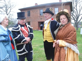 There was no shortage of people dressed in period dress Saturday at the War of 1812 weekend at the Backus Page House Museum. In period dress from Kitchener's Elegant Thimble group are left, Sheila Gibbs, Jim Gilbert and Paul and Charlene Roberts.