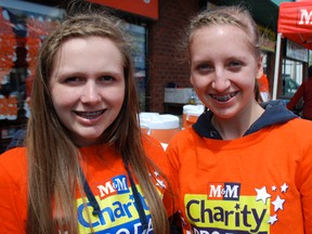 MONTE SONNENBERG Simcoe Reformer
The M&M Meats barbecue on behalf of the Crohn’s & Colitis Foundation Saturday was a big success due to the help of numerous volunteers. Among those helping out at the store on the Queensway West in Simcoe were Tegan Meulemeester, left, of Vittoria, and Nikita Keller of Vittoria.