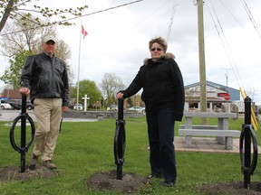 Brian Vidler, left, and his wife Heidi want the metal bike racks removed from the Erieau Veterans Memorial Garden. The couple are retired from the military and believe the installation last week was disrespectful and short sighted.