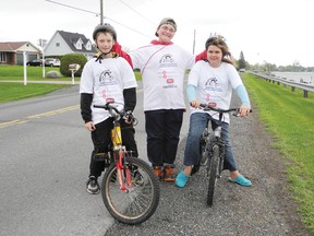 Morrisburg residents Jacob Venema and Brianna O’Neil were joined by Williamsburg friend Travis Merkley (centre) for the Bike-a-Thon event along the South Dundas waterfront Saturday.
Staff photo/KATHRYN BURNHAM