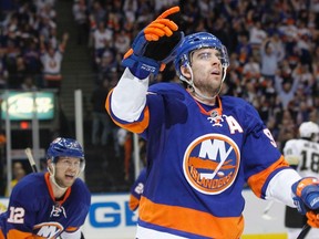 New York Islanders' John Tavares celebrates his goal against the Pittsburgh Penguins' with teammate Josh Bailey (12) during the third period of their Stanley Cup playoffs Eastern Conference quarter-final game in Uniondale, New York, May 7, 2013. (REUTERS/Shannon Stapleton)
