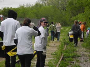 About 200 volunteers turned out Saturday to help clear the riverbanks of trash and dangerous debris during the 12th annual Grand River Environmental Festival. Volunteers collected dozens of garbage bags full of waste from an area immediately south of the Lorne Bridge. (HEATHER IBBOTSON, The Expositor)