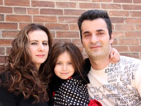 Ganimete Berisha, 29, left, and her husband Muhamet Bajraktari, 36, have worked since arriving in Canada in 2007, but worry about their future and that of their daughter, Eliza, as they face deportation to Kosovo. (ELLWOOD SHREVE, The Daily News)