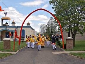 Young Sikhs, playing drums and trumpets, leave the temple on Park Road North for annual Khalsa Day parade on Sunday afternoon. (KARA WILSON, for The Expositor)