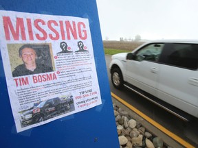 A poster seeking information about the disappearance of Tim Bosma is displayed at Waterloo International Airport. (JACK BOLAND, QMI Agency)