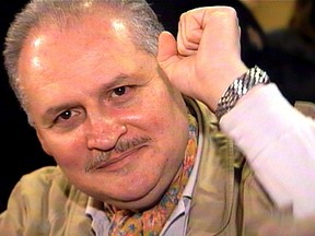 Ilich Ramirez Sanchez, better known as "Carlos the Jackal", raises his fist as he appears in court in this still image made from video footage, Paris in this November 28, 2000, file photo. REUTERS