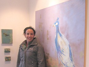 Amanda Melinz poses with her work at the Victoria Park Gallery on Friday, May 10, 2013. Melinz's work will be displayed all month long as she is the gallery's guest artist for May. (AVERY LAFORTUNE/KINCARDINE NEWS CO-OP STUDENT)