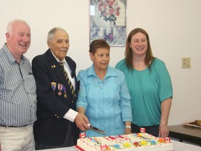 LEFT TO RIGHT: Jan Goedendorp, George Impey, Klara Goedendorp-Impey, and Jessica Gallo-Goedendorp pose for a picture before cutting a birthday cake celebrating Impey’s 91st birthday and the reunion of his daughter, Klara, after more than 60 years.