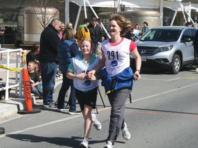 A mother and her daughter smile as they cross the finish line holding hands. The duo ran in the Mother’s Day Charity Road Race that started and finished at the White Cap Pavilion in Kenora on Sunday, May 12.
GRACE PROTOPAPAS/Miner and News