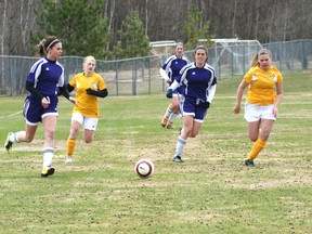 Beaver Brae’s Stephanie Sparkman looks up before crossing the ball into the 18 yard box during a game at the Beaver Brae Soccer Tournament on May 11-12. The Broncos had a mixed weekend ending in fourth position with a 1-3 record.
FILE PHOTO/Daily Miner and News