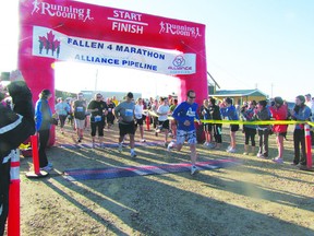 A set of runners begins the 2012 Fallen 4 Marathon at the Fallen Four Memorial Park