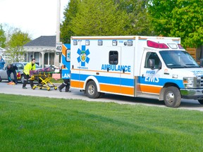 A Saugeen Shores teenager is attended to by emergency personnel, after being struck by a car Monday morning on Waterloo Street in Port Elgin. He was later transferred to a London hospital with serious, but non-life threatening injuries (TIFFANY WILSON/SHORELINE BEACON/QMI)