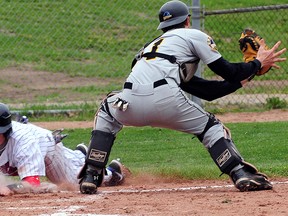 Leadoff hitter Chris McQueen beats the tag of Kitchener Waterloo catcher Cody Engel with the Tomcats' first run of the home season as they beat the Jr. Panthers 10-9 Saturday at Emslie Field. R. MARK BUTTERWICK / St. Thomas Times-Journal / QMI AGENCY
