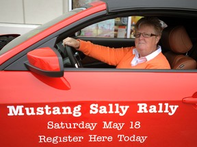 Mustang Sally Rally Poker Run co-chair coordinator Julianne Higdon gets behind the wheel of a Lambton Ford Mustang advertising the fundraiser on Saturday,May 11, 2013 in Sarnia, Ont. PAUL OWEN/THE OBSERVER/QMI AGENCY