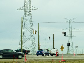 New traffic signals installed at the Highway 216 off-ramps at Baseline Road help vehicles make left-hand turns. The signals went into operation on Monday morning, backing up westbound rush hour traffic to Chippewa Road in Sherwood Park. Michael Di Massa/Sherwood Park News/QMI Agency