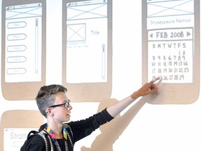 Harrison Lobb, 14, of Goderich District Collegiate Institute, outlines an app his group created for the Canada 3.0 Youth Program at the University of Waterloo Stratford campus Monday. (SCOTT WISHART The Beacon Herald)