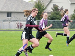 EDDIE CHAU Simcoe Reformer
Melissa Lopes (left) of the Holy Trinity Titans gives chase to the ball while Mara Wilson from Valley Heights Bears follows during a NSSAA girls soccer game Monday at Holy Trinity. The Titans toppled the Bears 1-0.