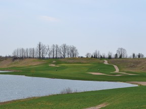 The picturesque and signature hole of Black Horse Golf Club, number three with its beautiful water hazard to the left.