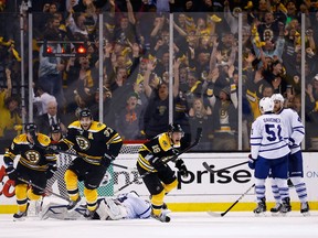Patrice Bergeron, Tyler Seguin and Brad Marchand of the Boston Bruins celebrate following Bergeron's game-winning overtime goal against the Toronto Maple Leafs in Game Seven of the Eastern Conference Quarterfinals. (AFP/Getty)
