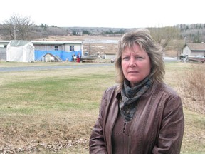 For the past three years, Muriel Lake resident Connie Mellon has led a neighbourhood appeal for an investigation into the living conditions of dogs and other animals confined to a trailer (pictured in background) in Pellatt Township.
REG CLAYTON/Daily Miner and News