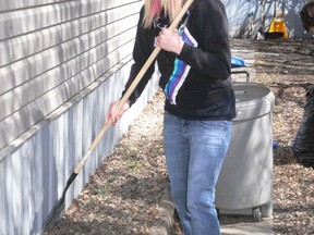 Alyssa Schelchte cleaned up outside during the nice weather on Saturday, May 11.