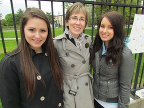 From left, Breanne Pollard, a youth currently in care, Dawn Flegel, executive director of the Sarnia Lambton Children's Aid Society, and Sonja Reid, 22, a former youth in care, attended Tuesday's Children and Youth in Care Day held at Sarnia's Centennial Park. It's aim is to raise awareness about issues faced by children and youth connected to Ontario's child welfare system. Sarnia, Ont., May 14, 2013 PAUL MORDEN/THE OBSERVER/QMI AGENCY